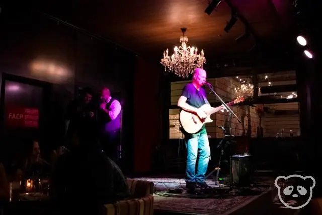 A man singing on stage at Culinary Dropout. 