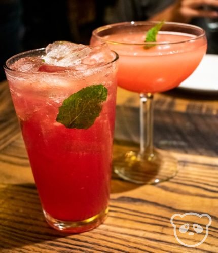 Non-alcoholic prickly pear soda drink to the left and prickly pear frozen cocktail to the right.