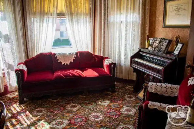 Front room of the house with sofa and piano