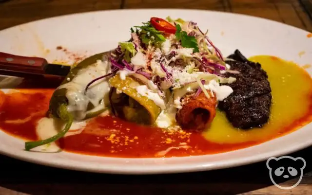 Ghost Ranch sampler platter includes a chile relleno, pork enchilada, chicken enchilada, and a piece of steak.