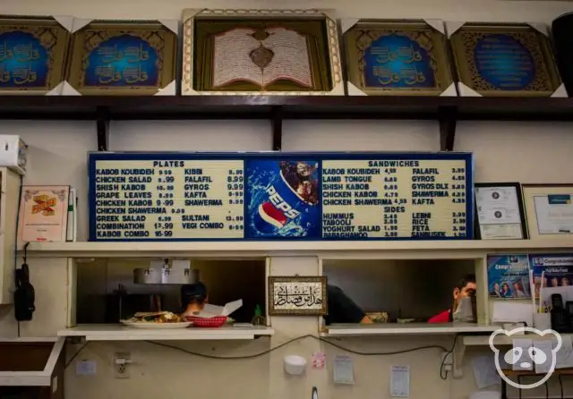 Menu and decorations behind the cash register. 