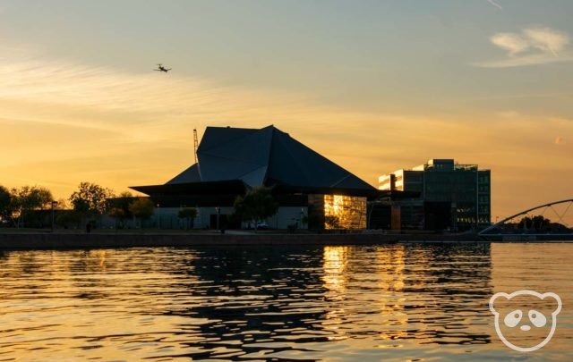 Tempe Center for the Arts with an airplane next to it taken from the middle of Tempe Town Lake. 