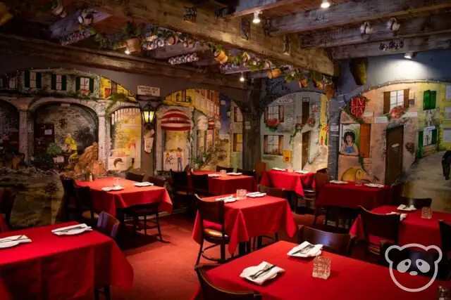 Restaurant dining room interior with tables and chairs.