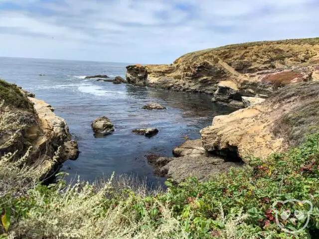 View into a cove surrounded by rock. 