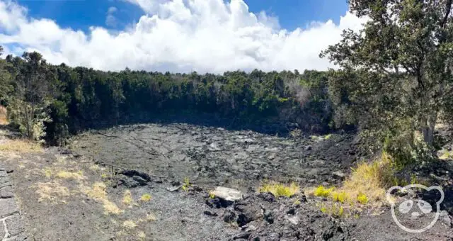 Volcanic crater surrounded by lush rainforest.