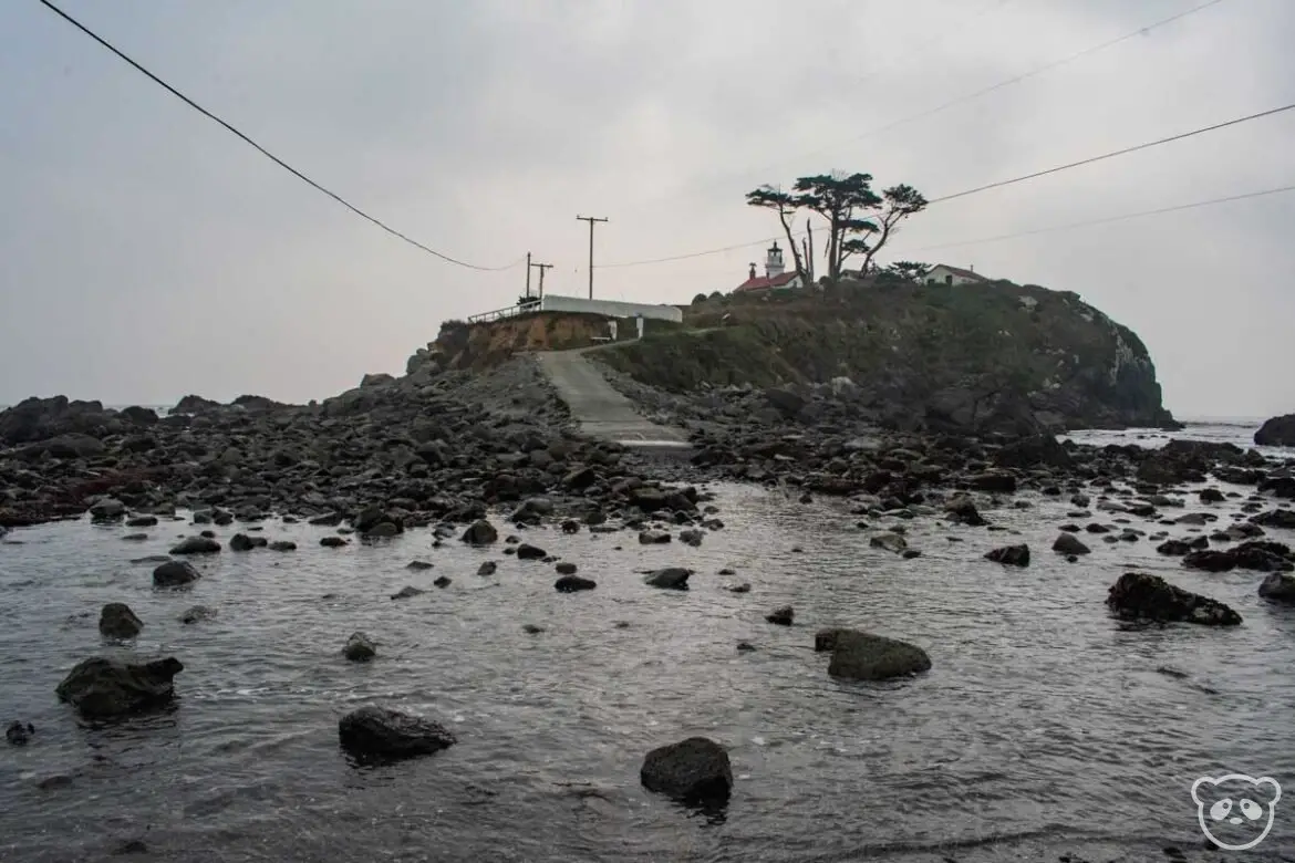 Battery Point during high tide with water covering the path.